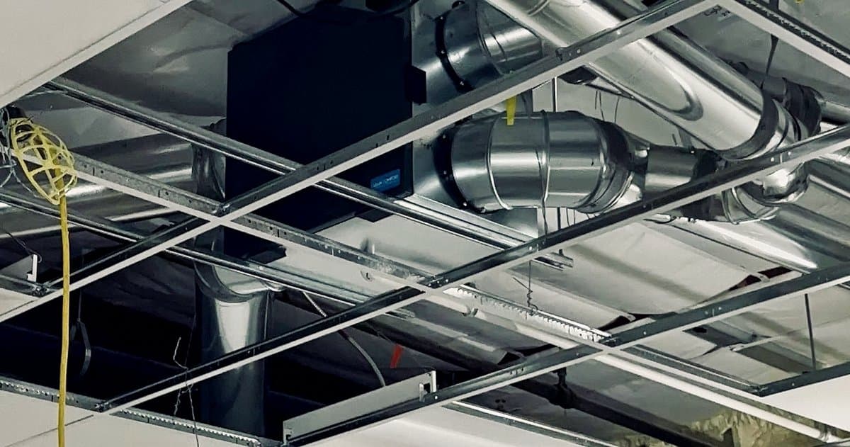 Spiral ductwork run above a suspended ceiling grid